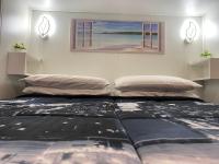 Posteľ alebo postele v izbe v ubytovaní "The Gole of Alcantara Living in the Dream's Room"