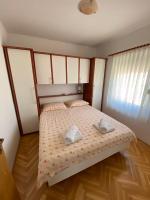 Postel nebo postele na pokoji v ubytování Apartman Vita