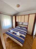 Postel nebo postele na pokoji v ubytování Apartman Vita