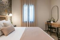 A bed or beds in a room at Αngelikon Luxurious Apartments