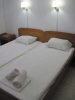 Postel nebo postele na pokoji v ubytování Tatsis Apartments