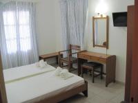 Postel nebo postele na pokoji v ubytování Tatsis Apartments