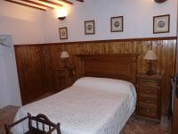 Postel nebo postele na pokoji v ubytování CASA RURAL QUIJOTE Y SANCHO