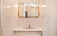 a bathroom with a sink and a mirror at Nice Home In Canchy With Kitchen in Canchy