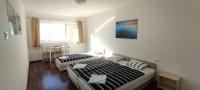 Posteľ alebo postele v izbe v ubytovaní Wesselényi Strand apartmanok
