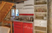a kitchen with a red refrigerator and a sink at Lovely Home In Padirac With Wifi in Padirac