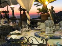 a table set up for a meal at a restaurant at Villa Neptunus in Ischia