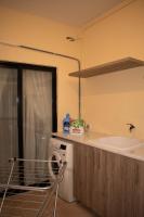 a kitchen with a sink and a washing machine at Spacious 3 bedroom apartment in Marsascala in Marsaskala