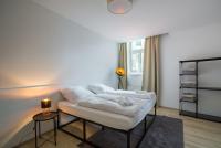 A bed or beds in a room at Servus at Naschmarkt