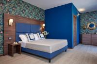 Posteľ alebo postele v izbe v ubytovaní Hotel Spigamonti