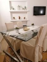 TV a/nebo společenská místnost v ubytování CASA VERDINA, nel cuore di Alghero