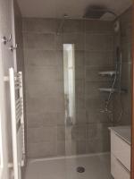 a shower with a glass door in a bathroom at APPARTEMENT VUE OCEAN ET PISCINE in Lacanau