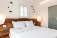 Postel nebo postele na pokoji v ubytování Elements Sifnos Boutique
