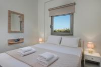 Posteľ alebo postele v izbe v ubytovaní SEA BREEZE APARTMENTS