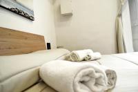 Posteľ alebo postele v izbe v ubytovaní Vanzi Rooms