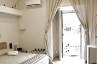 Posteľ alebo postele v izbe v ubytovaní Vanzi Rooms