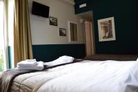 Posteľ alebo postele v izbe v ubytovaní Il Viaggio di Dante Historical Center
