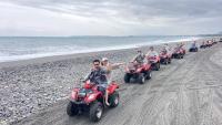 a group of people riding on atvs on a beach at Hualien Seaside B&amp;B in Hualien City