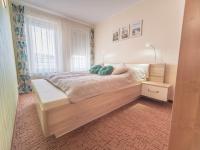 Posteľ alebo postele v izbe v ubytovaní Moya Bay Apartament