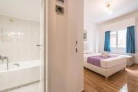 Postel nebo postele na pokoji v ubytování Victoria Majestic Suites Apartments