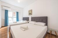 Postel nebo postele na pokoji v ubytování Victoria Majestic Suites Apartments