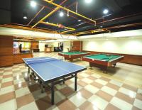 a large room with two ping pong tables in it at Kenting Holiday Hotel in Hengchun South Gate