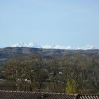 a view of snow covered mountains from a house at L&#39;oustal des Fontanilles in Castelnaudary