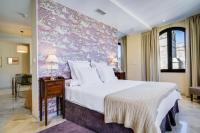 Posteľ alebo postele v izbe v ubytovaní Suites Murillo Alcázar