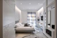 A bed or beds in a room at Maison Marienne - Deluxe B&B