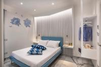 A bed or beds in a room at Maison Marienne - Deluxe B&B