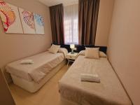 Posteľ alebo postele v izbe v ubytovaní Holiday Deluxe Apartment Miramar Magic World