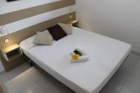 A bed or beds in a room at Agi Residencial Almadraba