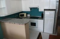 A kitchen or kitchenette at Agi Residencial Almadraba