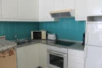 A kitchen or kitchenette at Agi Residencial Almadraba