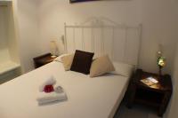 A bed or beds in a room at Agi Residencial Almadraba
