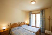 Postel nebo postele na pokoji v ubytování Apartaments Castellar de n'Hug