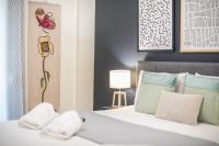 A bed or beds in a room at Elegant Suite by CloudKeys