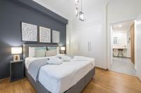 A bed or beds in a room at Elegant Suite by CloudKeys