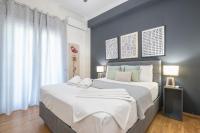 A bed or beds in a room at Elegant Suite by CloudKeys