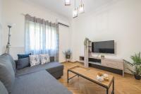 A television and/or entertainment centre at Elegant Suite by CloudKeys