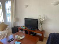TV a/nebo společenská místnost v ubytování Jávea Villa entière piscine et cuisine d'été à pinosol