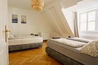 Łóżko lub łóżka w pokoju w obiekcie Comfort Apartments - Stephansdom