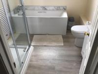 a bathroom with a shower and a toilet at Captivating 8-Bed House in Porthleven in Porthleven