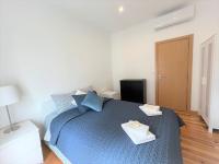 Postel nebo postele na pokoji v ubytování Lisboa Sweet Family Homestay