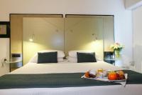 A bed or beds in a room at Hotel Buonconsiglio