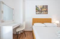 Postel nebo postele na pokoji v ubytování Victoria Sun Apartments
