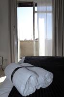 A bed or beds in a room at Essenza del Tempo Inn