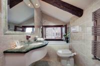 a bathroom with a sink and a toilet at Hotel Pausania in Venice