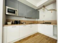 Kuchyňa alebo kuchynka v ubytovaní Apartament Morski Keja I Kołobrzeg Podczele
