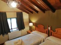A bed or beds in a room at Complejo la Regalina